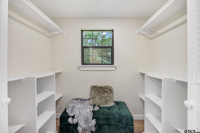 702 W Paschal St, Troup, TX 75789 - walk in closet featuring wood finished floors