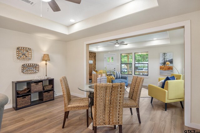 702 W Paschal St, Troup, TX 75789 - dining room featuring a raised ceiling, a ceiling fan, wood finished floors, and recessed lighting
