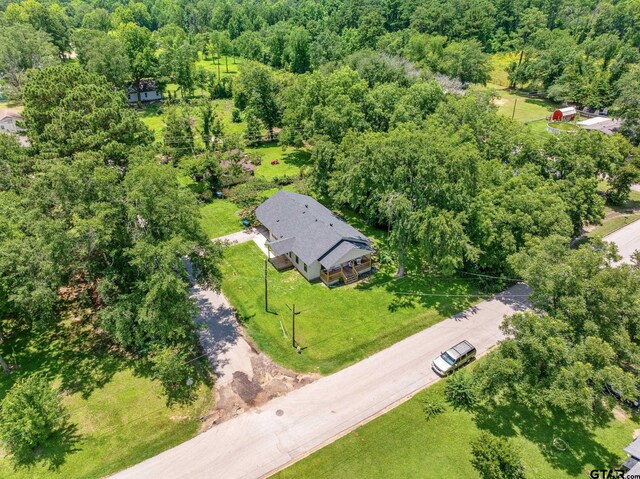 702 W Paschal St, Troup, TX 75789 - drone / aerial view of a heavily wooded area