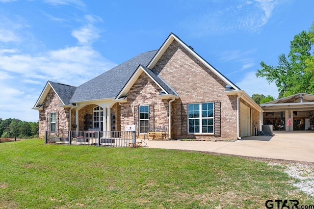 view of front of home with central air condition unit, a front lawn, driveway, a shingled roof, and brick siding