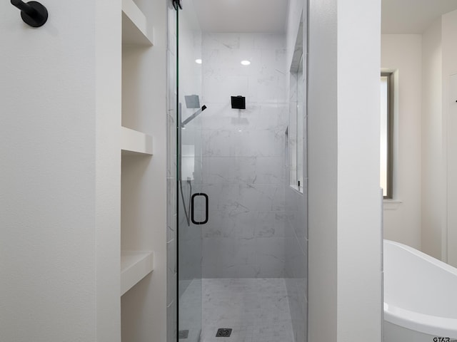 bathroom with separate shower and tub