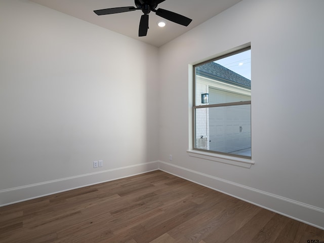 spare room featuring hardwood / wood-style flooring and ceiling fan