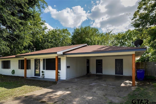 ranch-style home with a carport