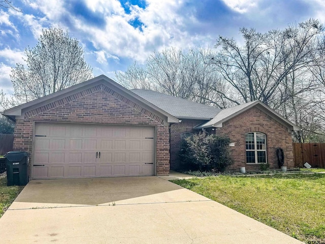 ranch-style home with brick siding, concrete driveway, a garage, and fence