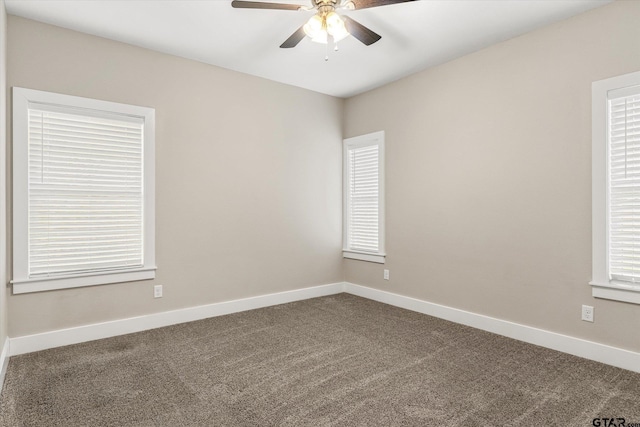 spare room featuring carpet flooring and ceiling fan