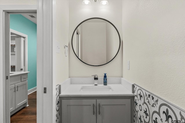 bathroom with hardwood / wood-style flooring and vanity