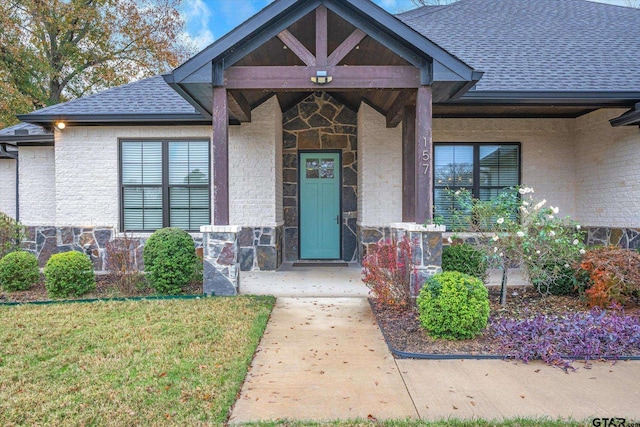 entrance to property with a yard