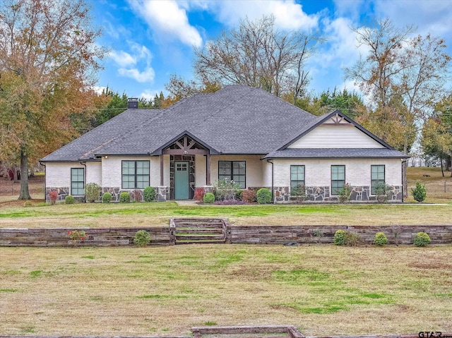 view of front of home with a front lawn