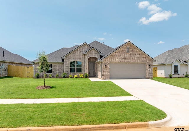 442 Mary Cir, Bullard, TX 75757 - view of front of house featuring brick siding, an attached garage, concrete driveway, and roof with shingles
