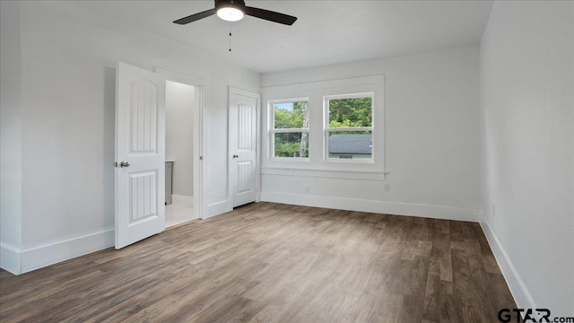 unfurnished bedroom featuring hardwood / wood-style flooring and ceiling fan