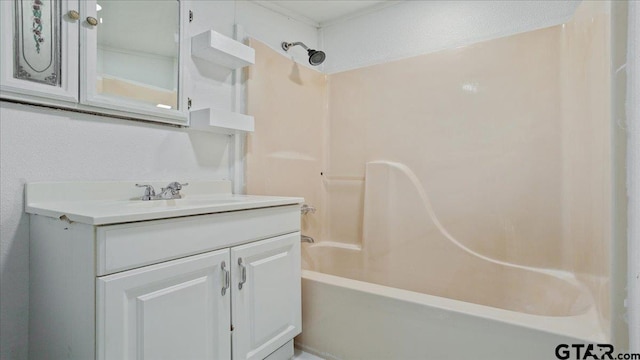 bathroom featuring tub / shower combination and vanity