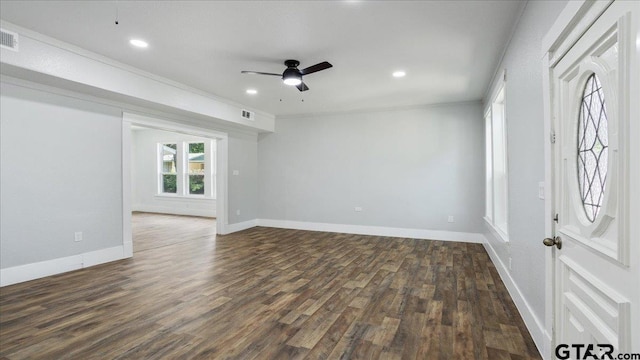 interior space featuring dark wood-type flooring and ceiling fan