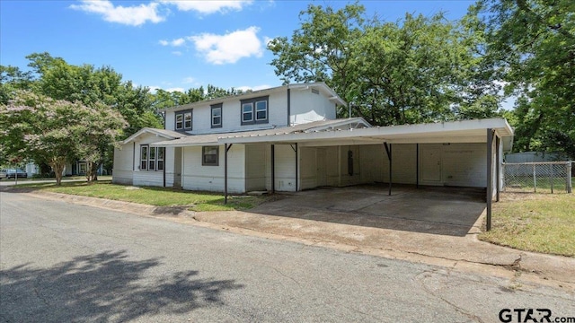 view of front of home featuring a carport