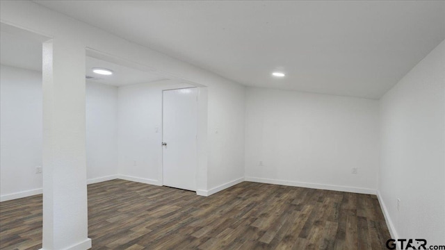 basement featuring dark hardwood / wood-style floors