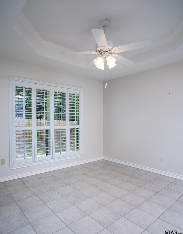 1521 Rice Rd Unit E105, Tyler, TX 75703 - empty room with a tray ceiling, ceiling fan, baseboards, and ornamental molding
