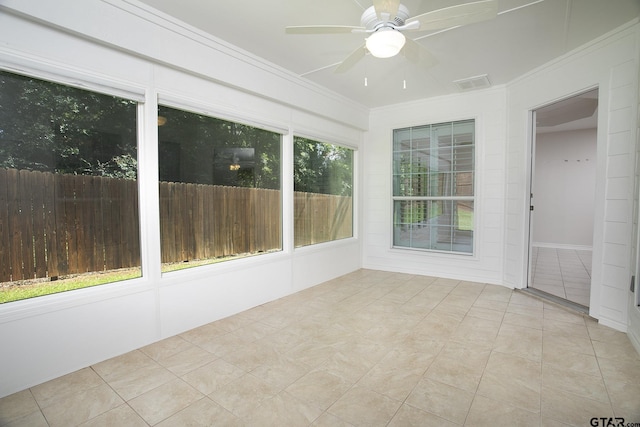 1521 Rice Rd Unit E105, Tyler, TX 75703 - unfurnished sunroom with a ceiling fan, crown molding, and tile patterned flooring