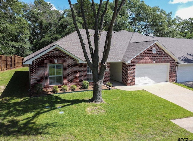 1521 Rice Rd Unit E105, Tyler, TX 75703 - view of front of house with brick siding, a garage, and roof with shingles