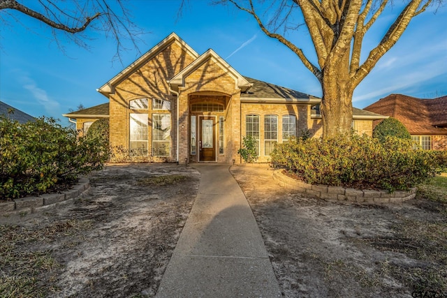 view of front of home with brick siding