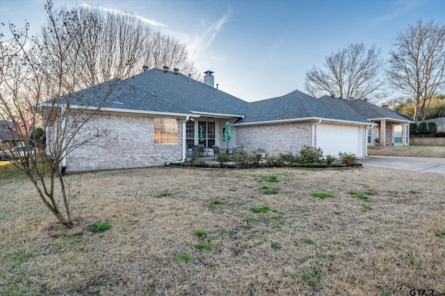 single story home with concrete driveway, brick siding, a chimney, and an attached garage