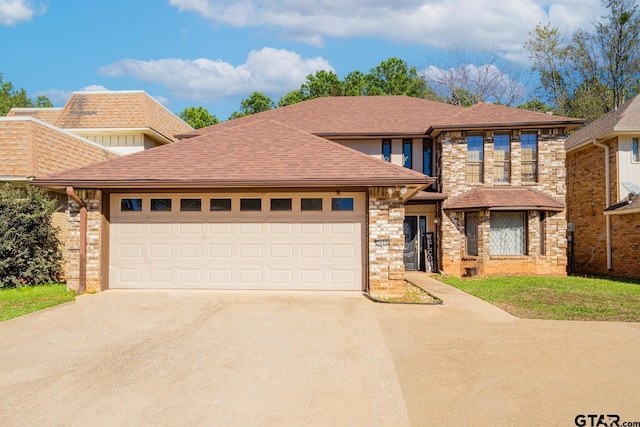 view of front of property with a garage