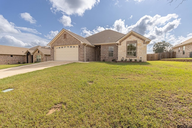 single story home with a garage and a front lawn