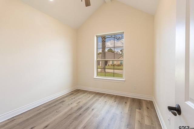 unfurnished room featuring ceiling fan, vaulted ceiling with beams, and light hardwood / wood-style floors