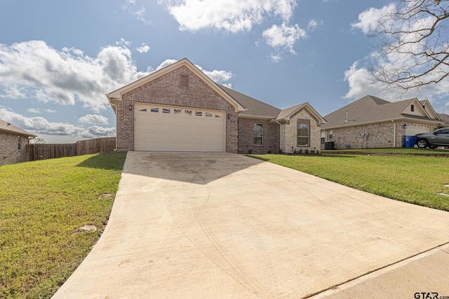 ranch-style house featuring a garage and a front yard