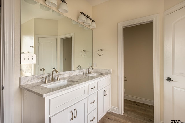 bathroom featuring vanity and hardwood / wood-style floors