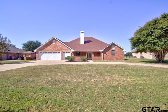 view of front of house featuring a garage and a front lawn