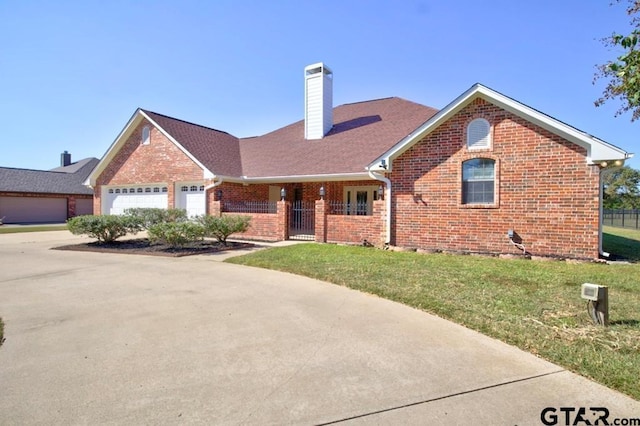 view of front facade with a front lawn and a garage