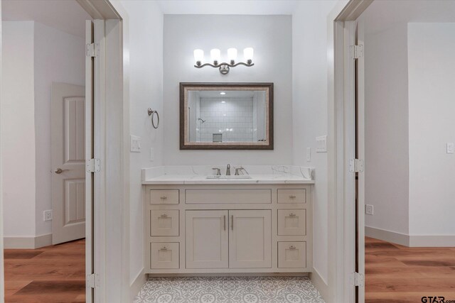 bathroom featuring hardwood / wood-style floors and vanity