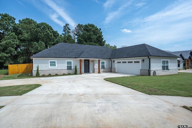 ranch-style house featuring a garage and a front yard