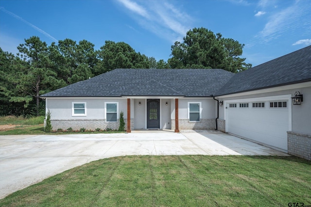 view of front of property featuring a garage and a front yard