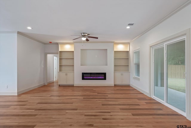 unfurnished living room with ornamental molding, light hardwood / wood-style flooring, and ceiling fan