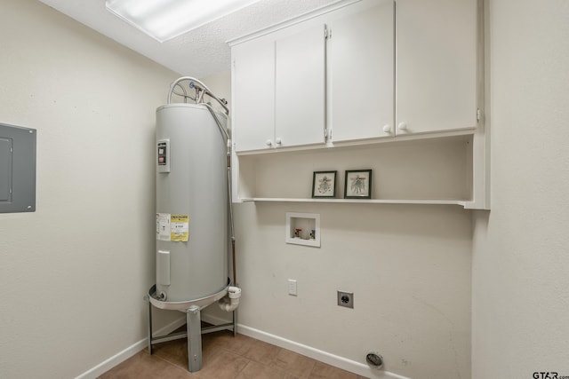 clothes washing area with cabinet space, electric panel, electric dryer hookup, water heater, and baseboards