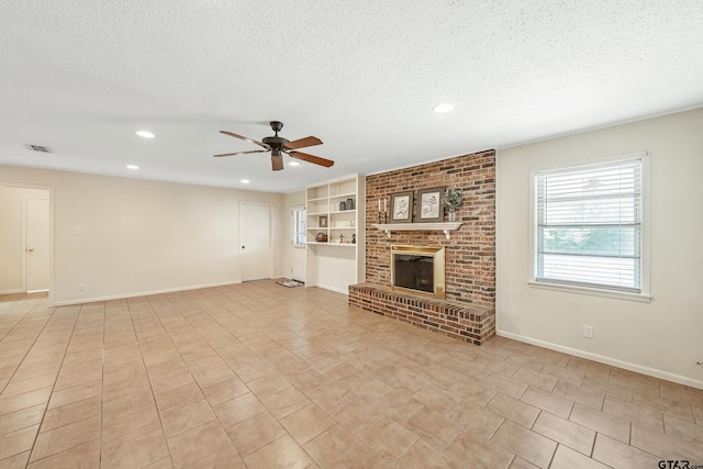 unfurnished living room with a textured ceiling, ceiling fan, recessed lighting, and baseboards