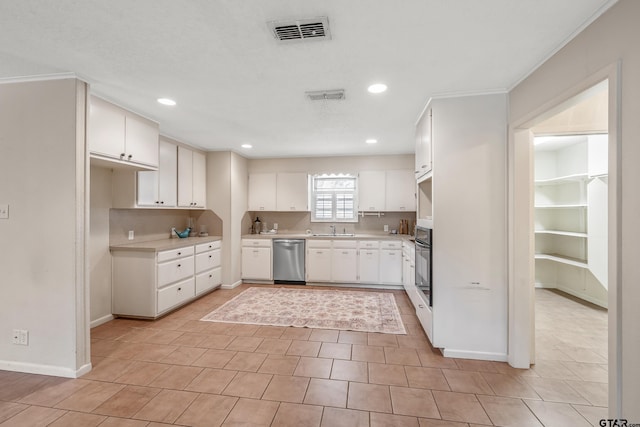 kitchen with recessed lighting, stainless steel dishwasher, oven, a sink, and visible vents