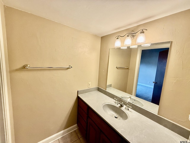 bathroom featuring tile patterned flooring and vanity