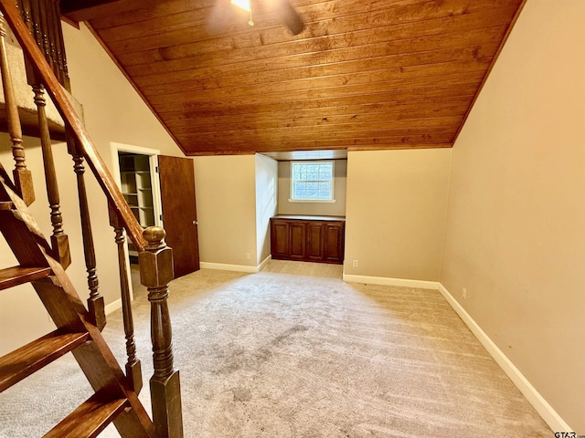 bonus room featuring wood ceiling, light colored carpet, and lofted ceiling