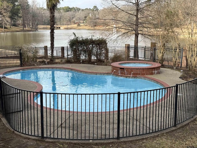 view of pool featuring an in ground hot tub and a water view