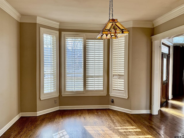 unfurnished dining area with crown molding and dark wood-type flooring