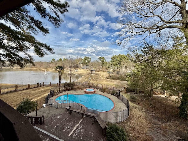 view of pool with an in ground hot tub and a deck with water view