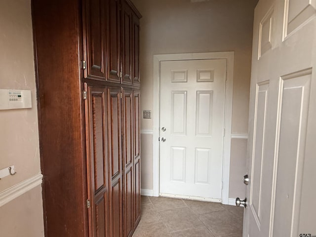 interior space with light tile patterned floors