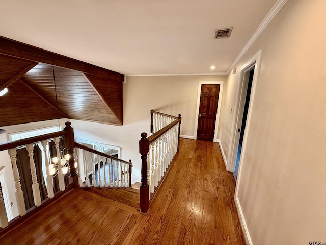 corridor featuring hardwood / wood-style flooring and ornamental molding