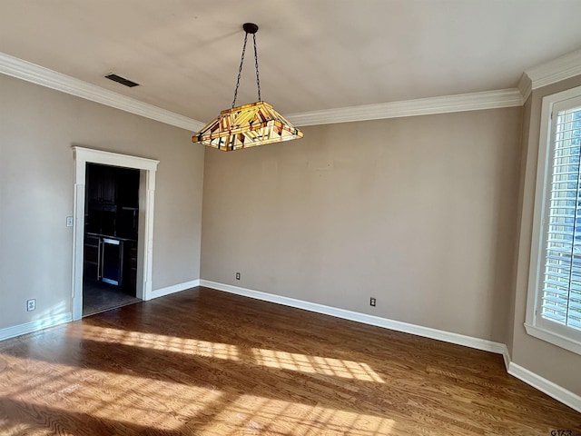 unfurnished room with crown molding and dark wood-type flooring