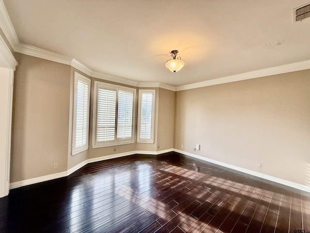 empty room with crown molding and dark hardwood / wood-style floors