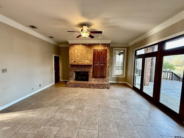 unfurnished living room featuring ceiling fan, ornamental molding, a fireplace, and light tile patterned floors