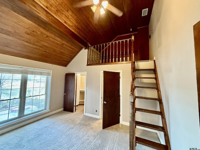 unfurnished bedroom with lofted ceiling, light colored carpet, wooden ceiling, and ceiling fan