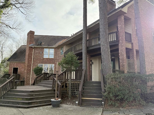 back of property with a balcony