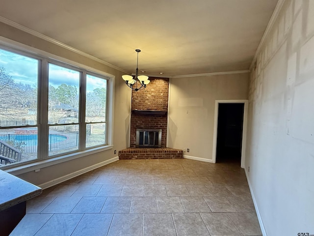 unfurnished living room featuring an inviting chandelier, a brick fireplace, crown molding, and light tile patterned flooring